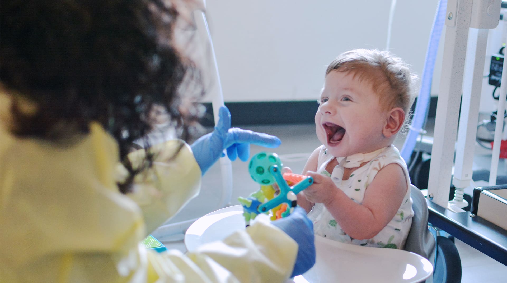 Asher interacting with caregiver.